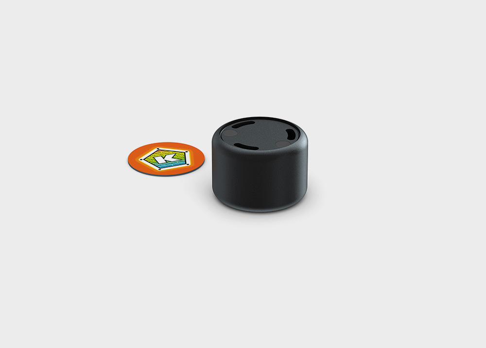 Black sensor with orange token on gray background, for use with the electronic board game Khet 2.0.